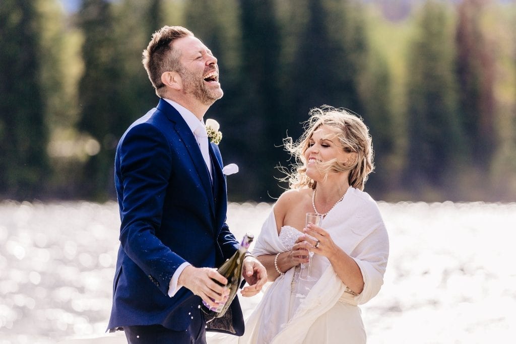 Bride and Groom celebrating after their ceremony on pyramid lake Jasper