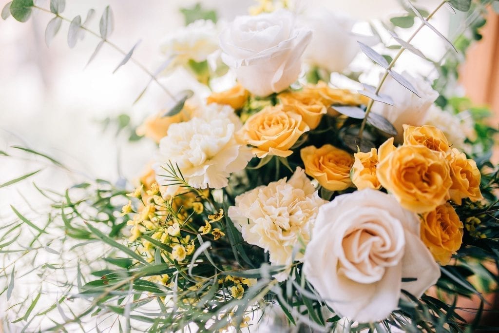 stunning flowers and centrepieces  in Peach, yellow and white plus greenery wedding inspiration