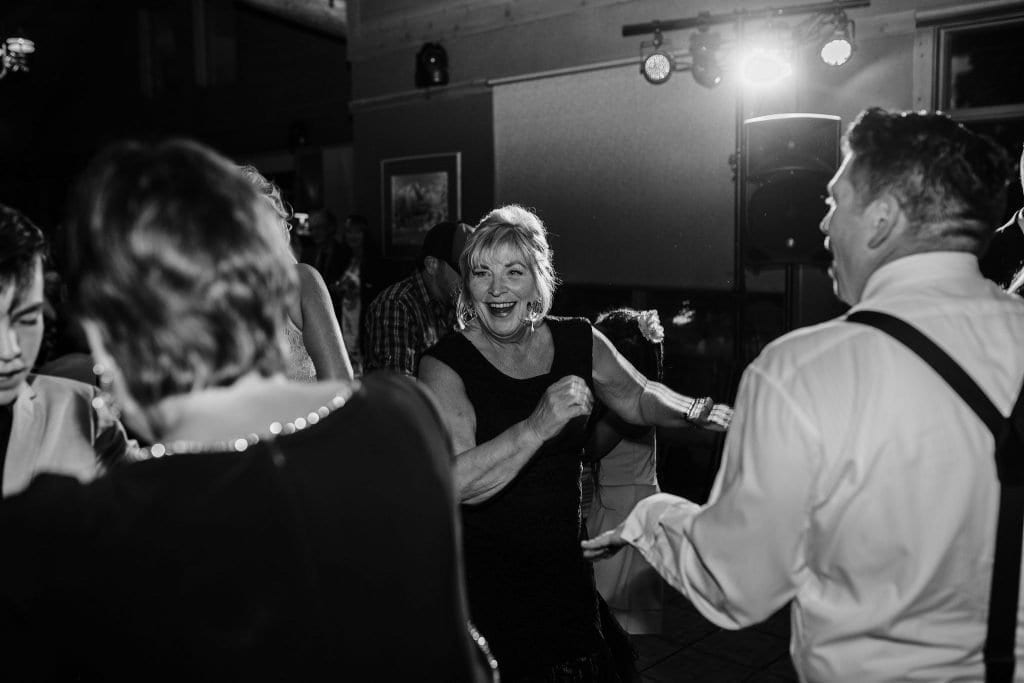 Mom of the groom dances during this Jasper Wedding reception photos