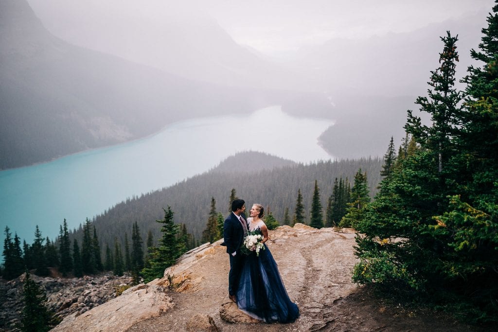 Couple eloping in the Rocky Mountains in a blue dress